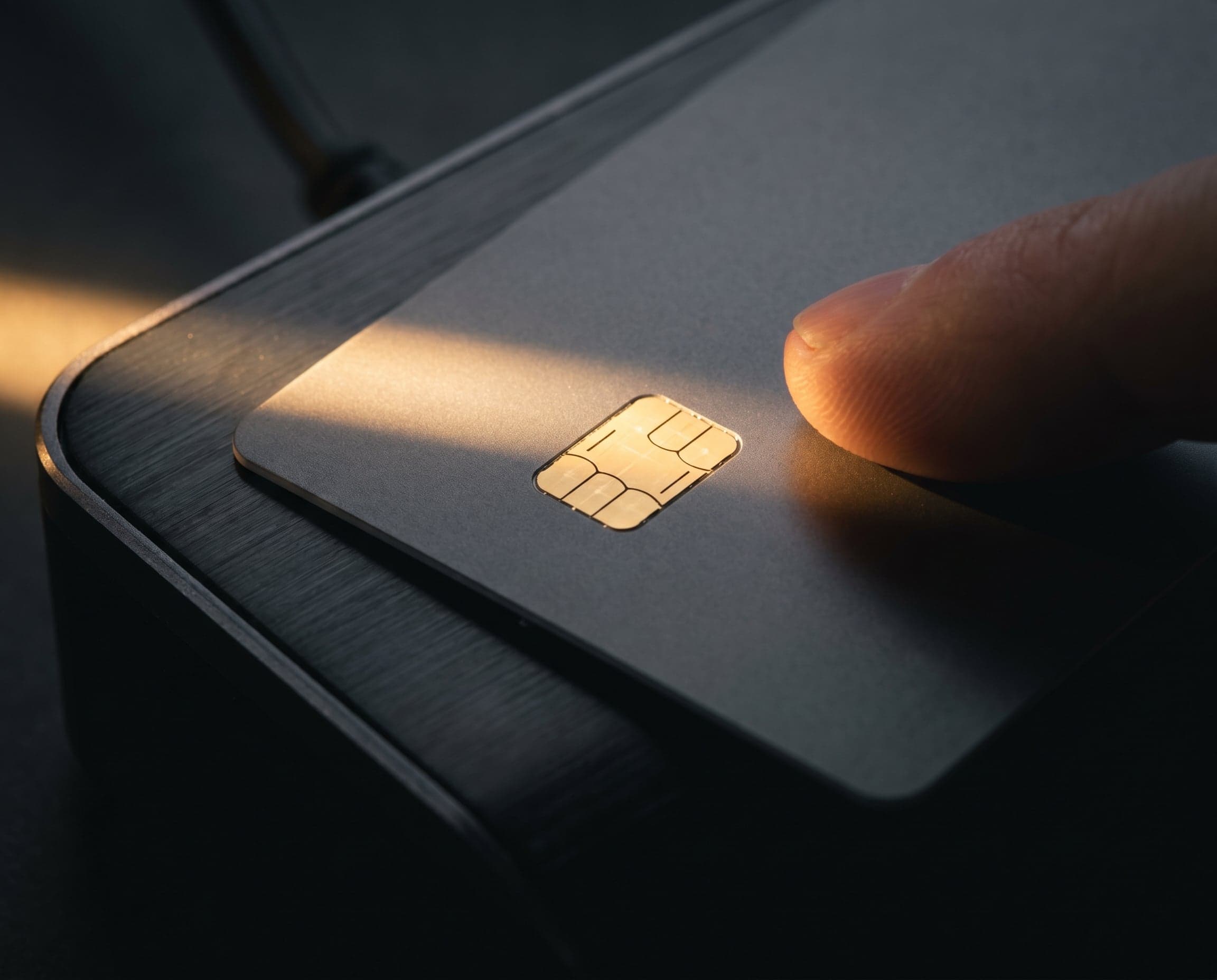 Customer tapping a card on a countertop terminal