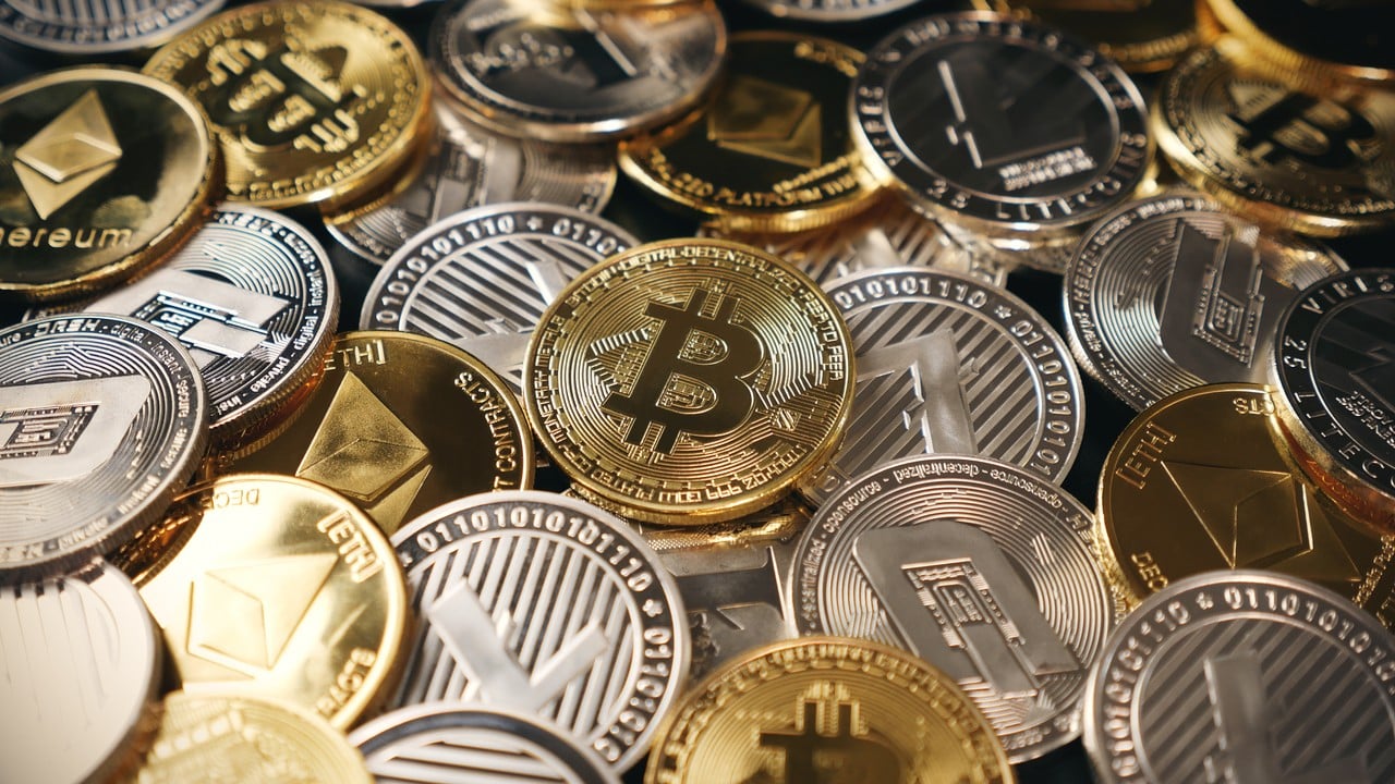A pile of physical Bitcoin, Ethereum and other cryptocurrency coins